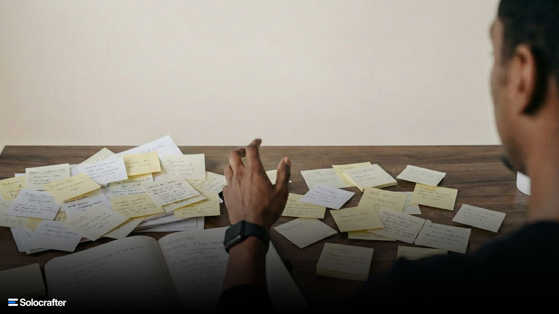 Developer at desk with disorganized tasks being reorganized into a clear system